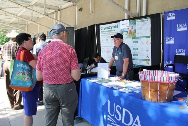 Mike Sexton speaks with exposition attendees at the USDA exhibit booth. Leaders of the U.S. Department of Agriculture (USDA) in Iowa teamed up to highlight the ways that USDA is putting farmers and ranchers first at the World Pork Expo at the Iowa State Fairgrounds in Des Moines, Iowa, on June 3 – 4. Trade show marketing procurement: a practical process